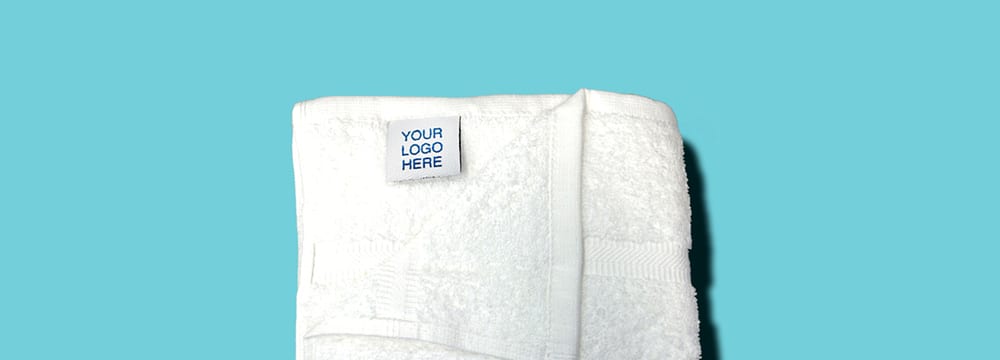 White Towel with "Your Logo Here" Tag