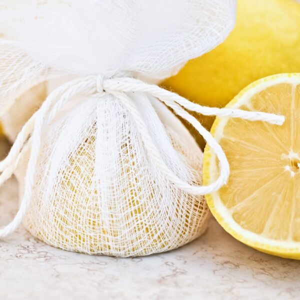 cheesecloth wrapped around half a lemon