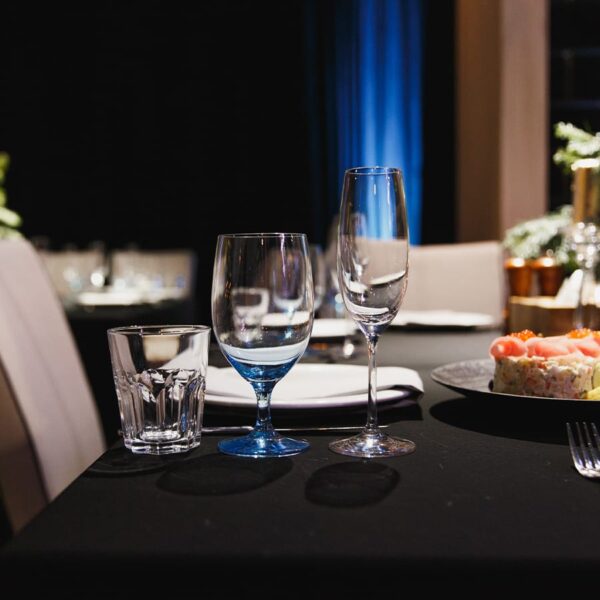 Wine glasses on black table linen