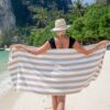 Beige Cabana Beach Towel around woman