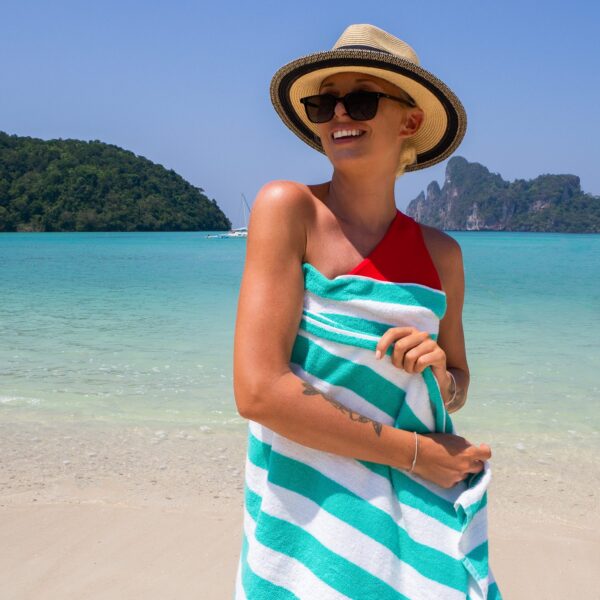 Green Cabana Beach Towel wrapped around woman