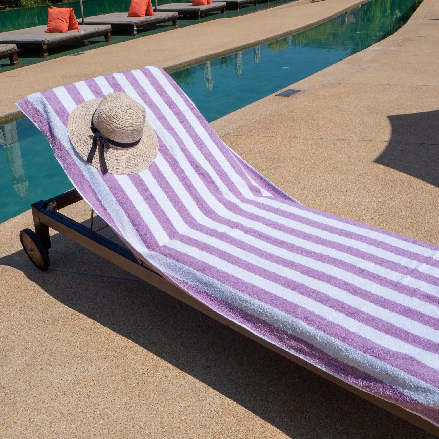 Purple Cabana Pool Towel on poolside chair