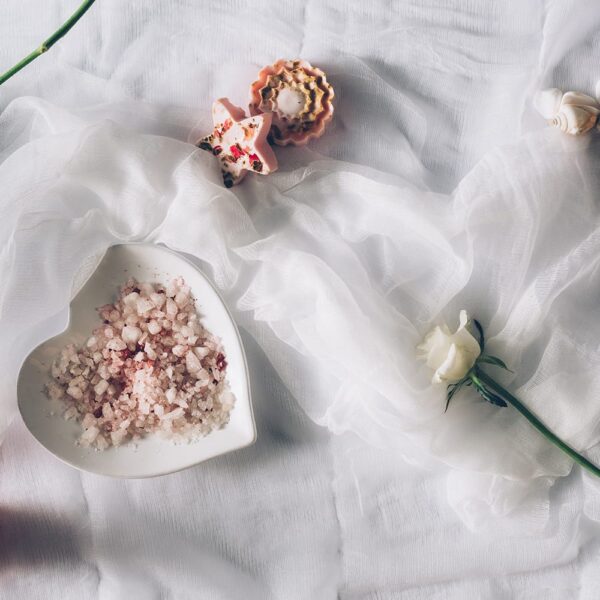 Cheesecloth laid out on table with trinkets on top