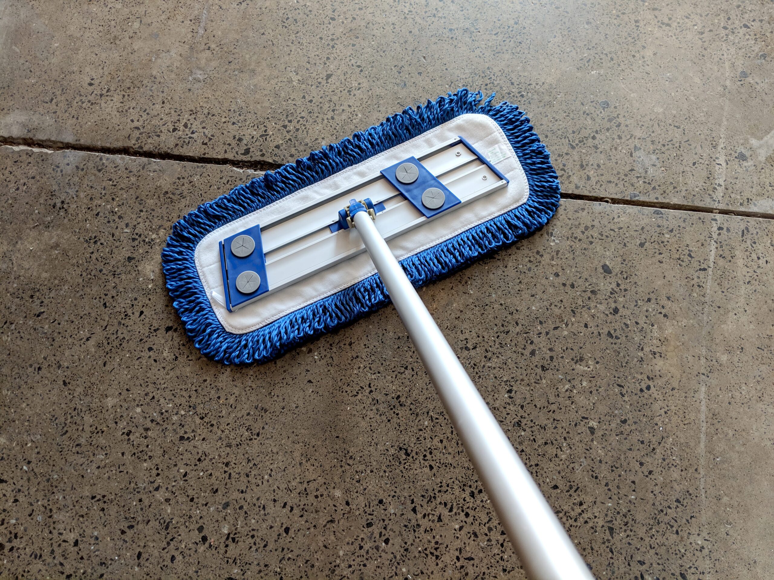 Fringed Dust Mops with Hook and Loop Backing on concrete