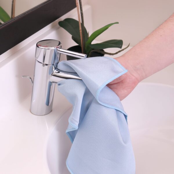 Shiny Blue Glass Cloth used to clean sink faucet