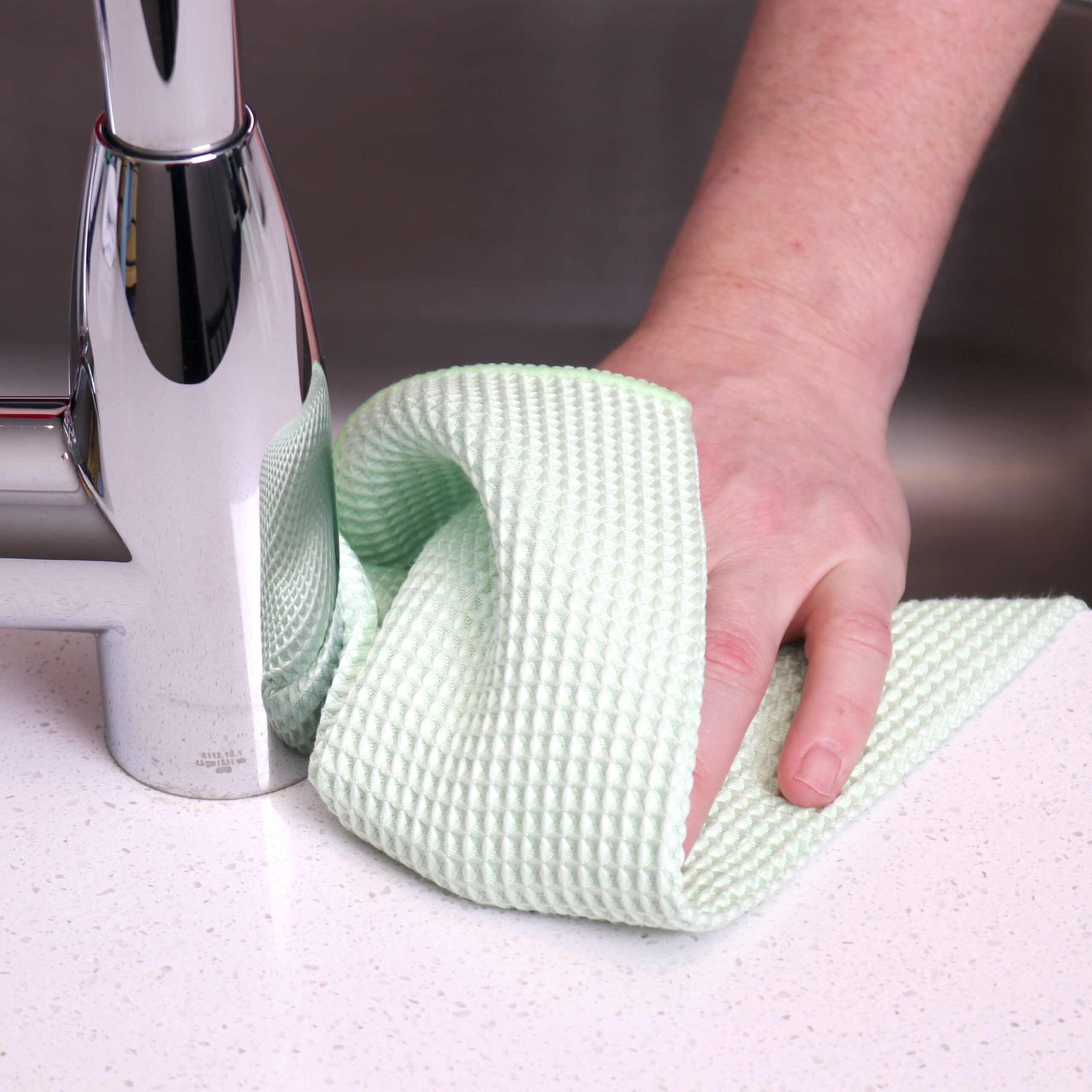 Green Waffle Microfiber Hand Towels used to clean counter