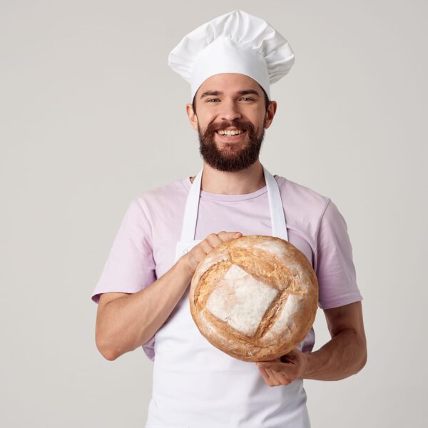 Baker wearing white Poly Spun Apron