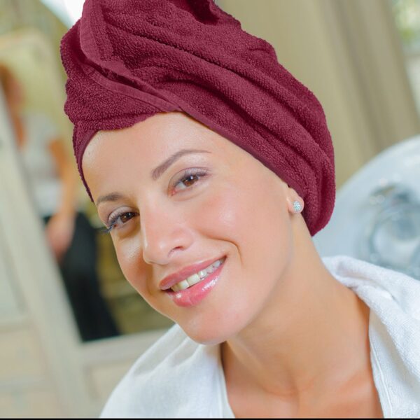 Lady wraps hair with burgundy True Color Bath and Hand Towels