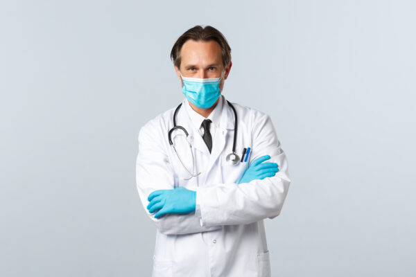 Doctor in medical mask and gloves