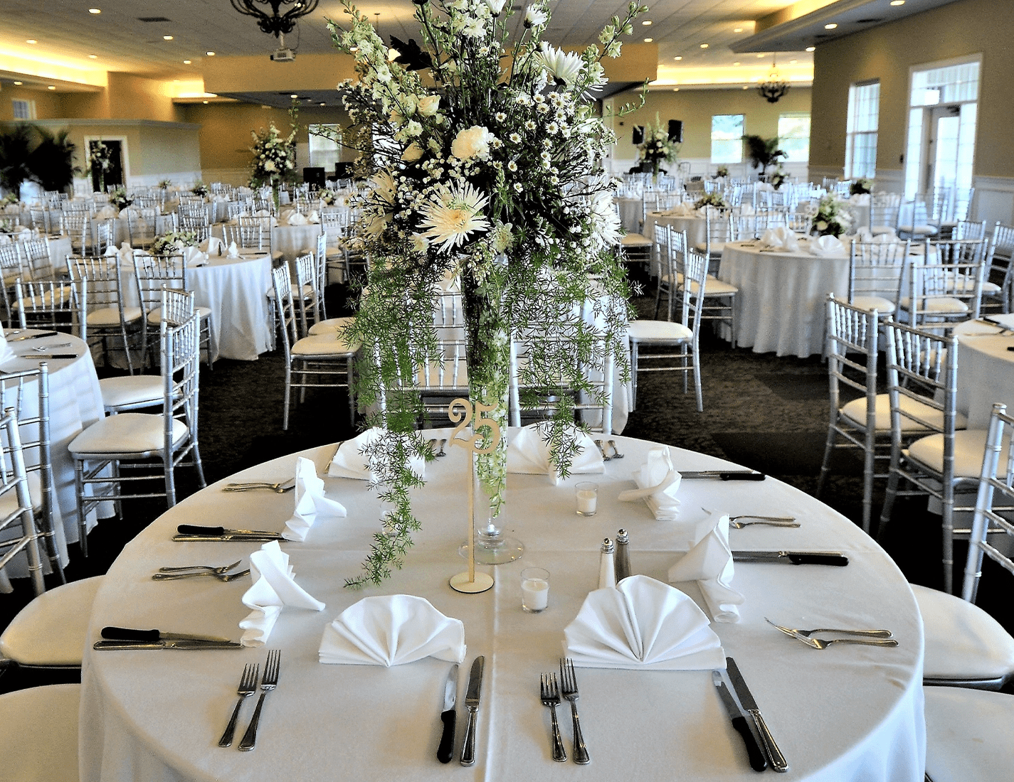 Banquet hall with table settings and centerpieces for wedding reception