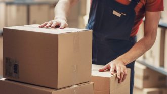 Warehouse worker unloading boxes