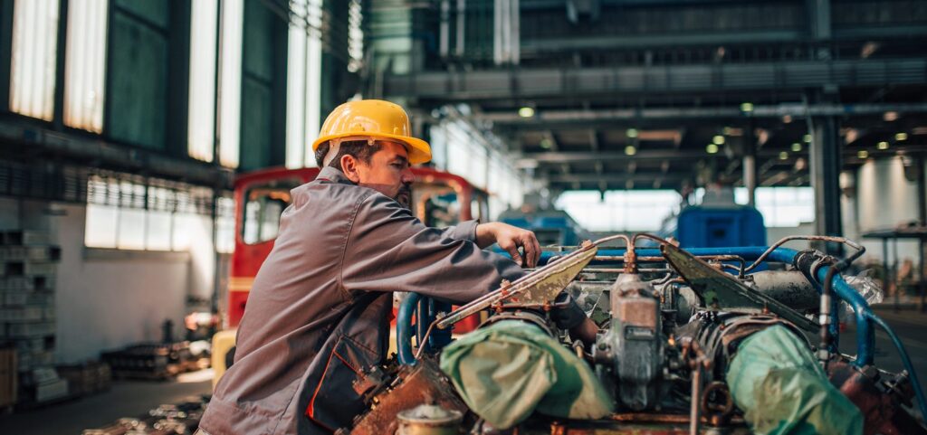 Header Image depicts worker using Janitorial Supplies for MRO